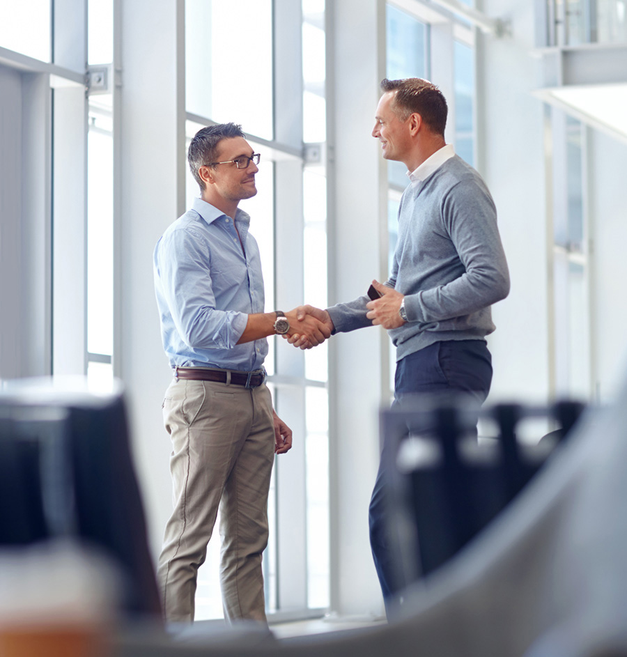 Business people, handshake or greeting in hotel lobby, modern of